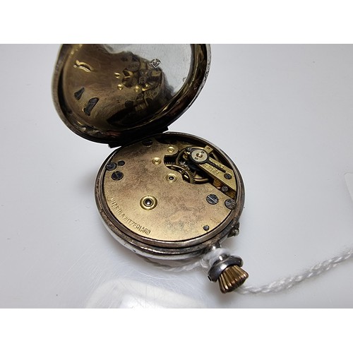 389 - A 925 silver fob watch with an ornate engraved case, the watch glass needs replacing but the dial is... 