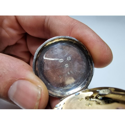 389 - A 925 silver fob watch with an ornate engraved case, the watch glass needs replacing but the dial is... 