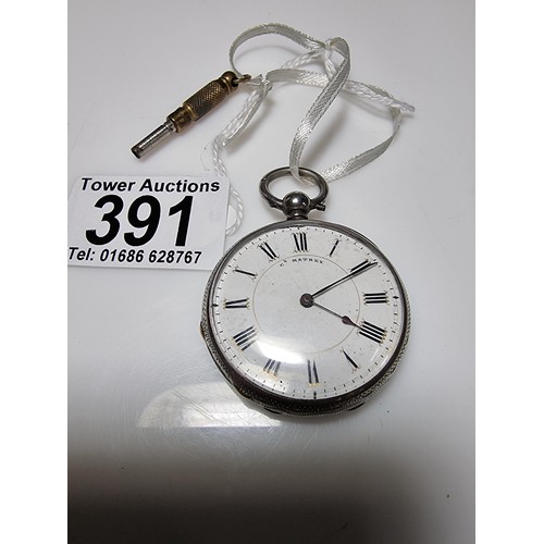 391 - A sterling silver pocket watch by C.Mathey, with a door which opens to the front and back. In good c... 