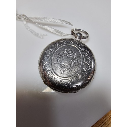 391 - A sterling silver pocket watch by C.Mathey, with a door which opens to the front and back. In good c... 