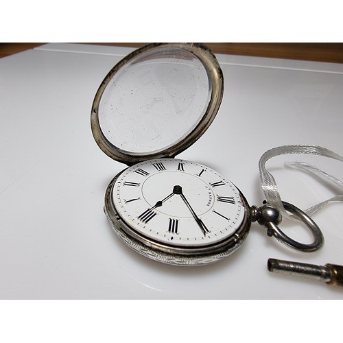 391 - A sterling silver pocket watch by C.Mathey, with a door which opens to the front and back. In good c... 