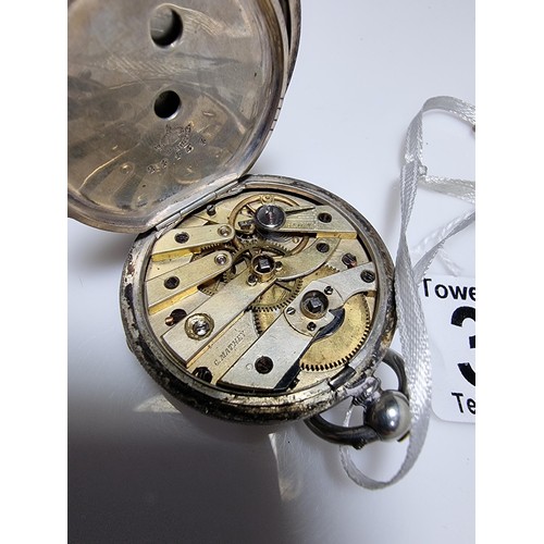 391 - A sterling silver pocket watch by C.Mathey, with a door which opens to the front and back. In good c... 