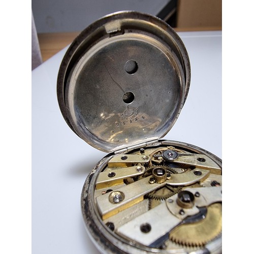 391 - A sterling silver pocket watch by C.Mathey, with a door which opens to the front and back. In good c... 