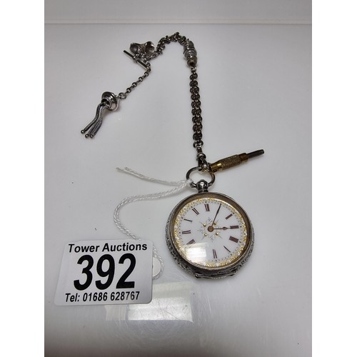392 - A good quality genuine Swiss 935 silver fob watch with an ornate engraved design featuring an ornate... 
