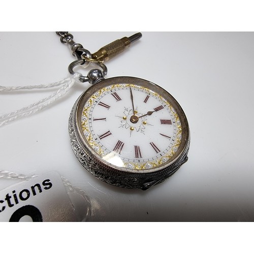 392 - A good quality genuine Swiss 935 silver fob watch with an ornate engraved design featuring an ornate... 