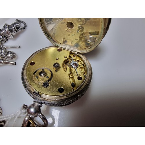 392 - A good quality genuine Swiss 935 silver fob watch with an ornate engraved design featuring an ornate... 