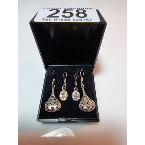 394 - 2 pairs of 925 silver drop earrings, both in clean condition marked 925.