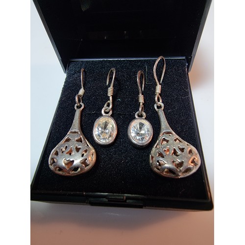 394 - 2 pairs of 925 silver drop earrings, both in clean condition marked 925.