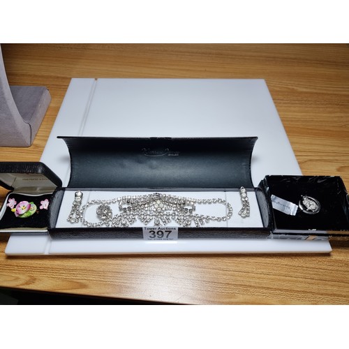 397 - A quantity of costume jewellery including a Spode brooch and earring set in good condition with no d... 