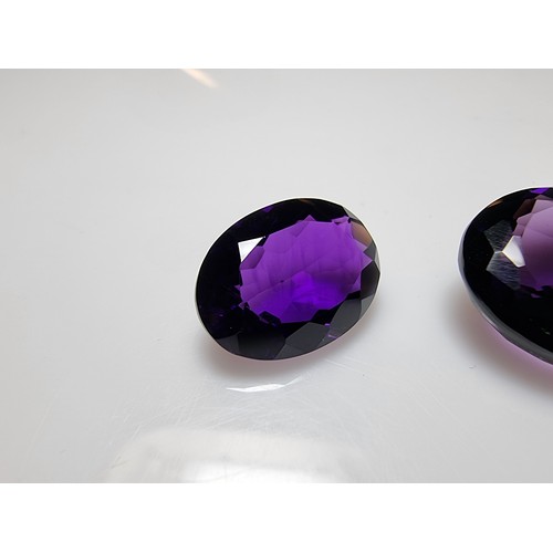 405 - A selection of 6 faceted gemstones to include 2 genuine tested as amethyst faceted gemstones and 4 o... 