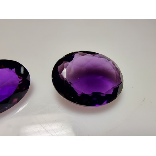 405 - A selection of 6 faceted gemstones to include 2 genuine tested as amethyst faceted gemstones and 4 o... 