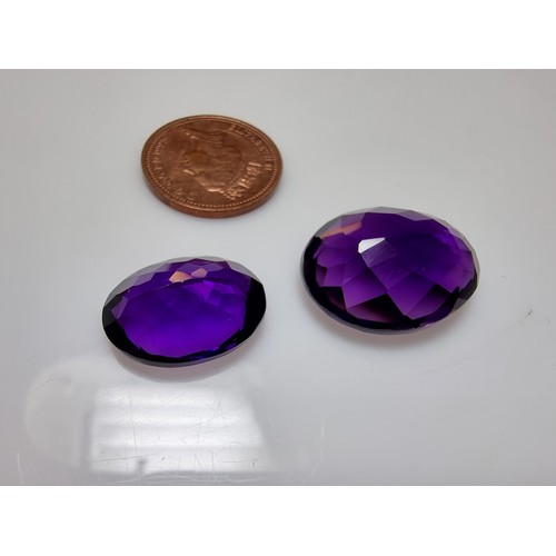 405 - A selection of 6 faceted gemstones to include 2 genuine tested as amethyst faceted gemstones and 4 o... 