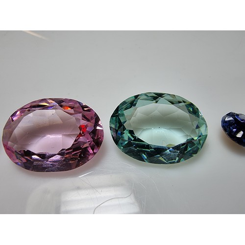 405 - A selection of 6 faceted gemstones to include 2 genuine tested as amethyst faceted gemstones and 4 o... 