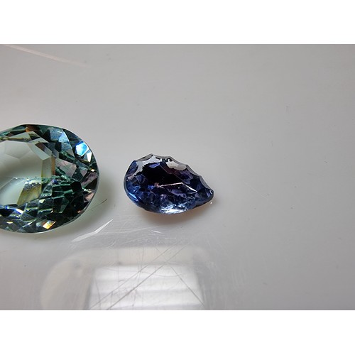 405 - A selection of 6 faceted gemstones to include 2 genuine tested as amethyst faceted gemstones and 4 o... 