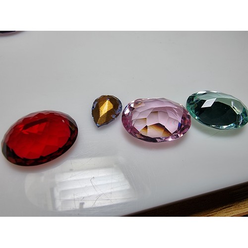405 - A selection of 6 faceted gemstones to include 2 genuine tested as amethyst faceted gemstones and 4 o... 