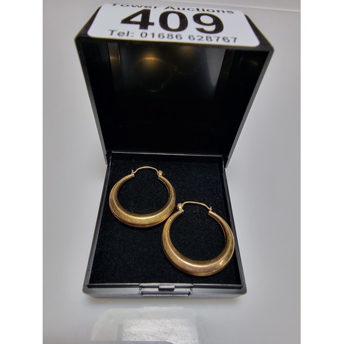 409 - A pair of rolled gold hoop earrings in excellent clean condition with no dents or dinks. Diameter of... 