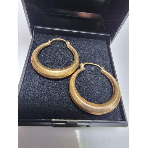 409 - A pair of rolled gold hoop earrings in excellent clean condition with no dents or dinks. Diameter of... 