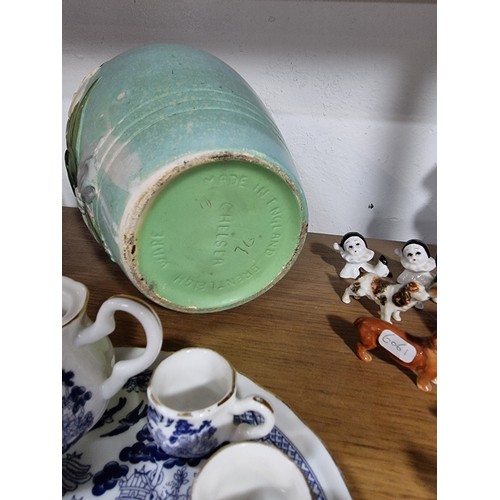 340 - A shelf full of good quality collectables including an interesting antique blue and white Chinese va... 
