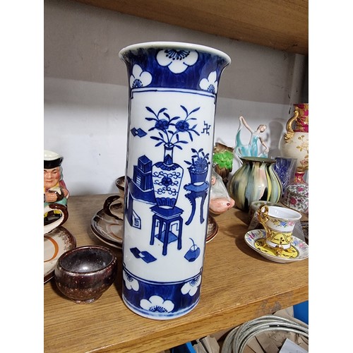 340 - A shelf full of good quality collectables including an interesting antique blue and white Chinese va... 