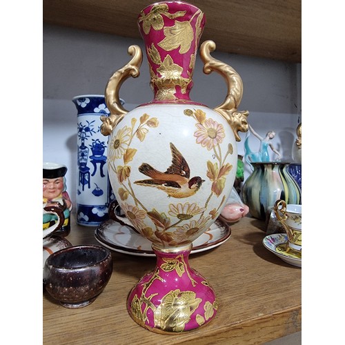 340 - A shelf full of good quality collectables including an interesting antique blue and white Chinese va... 