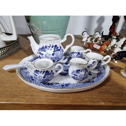 340 - A shelf full of good quality collectables including an interesting antique blue and white Chinese va... 