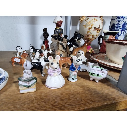 340 - A shelf full of good quality collectables including an interesting antique blue and white Chinese va... 