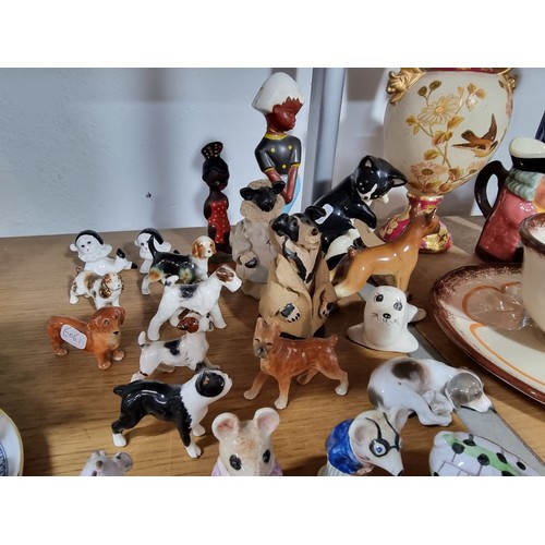 340 - A shelf full of good quality collectables including an interesting antique blue and white Chinese va... 