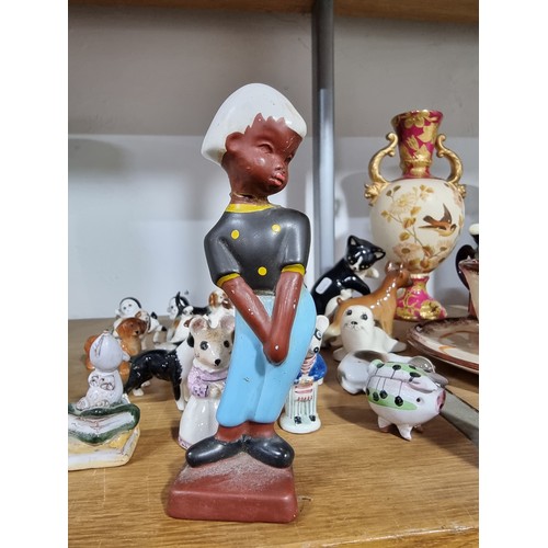 340 - A shelf full of good quality collectables including an interesting antique blue and white Chinese va... 