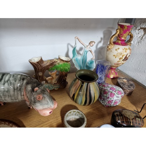 340 - A shelf full of good quality collectables including an interesting antique blue and white Chinese va... 