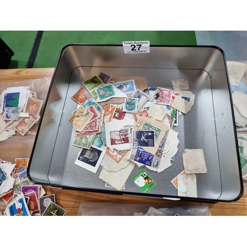 5 - A large quantity of loose stamps from around the world including many British ones in various packet... 