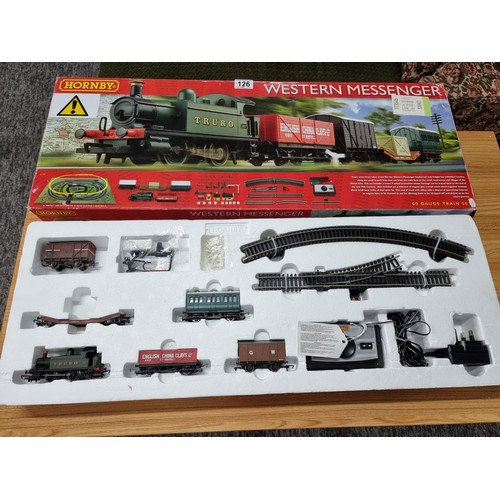 126 - A boxed Hornby R1142 Western Messenger train set to include an extra wagon, mostly complete just mis... 