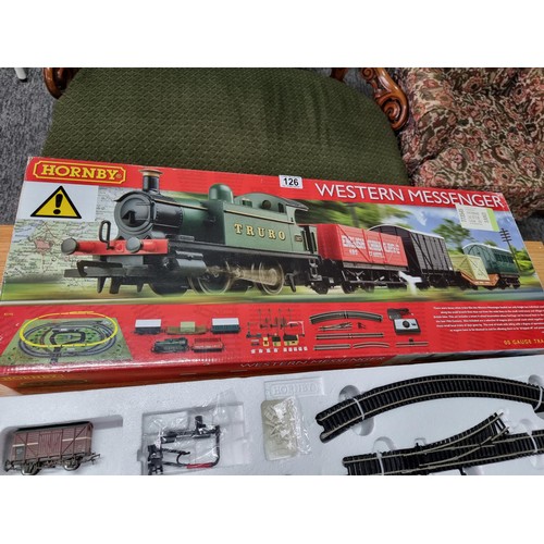 126 - A boxed Hornby R1142 Western Messenger train set to include an extra wagon, mostly complete just mis... 