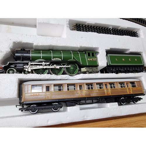 129 - A boxed Hornby R869 Flying Scotsman train set with starter oval, complete and in excellent clean con... 