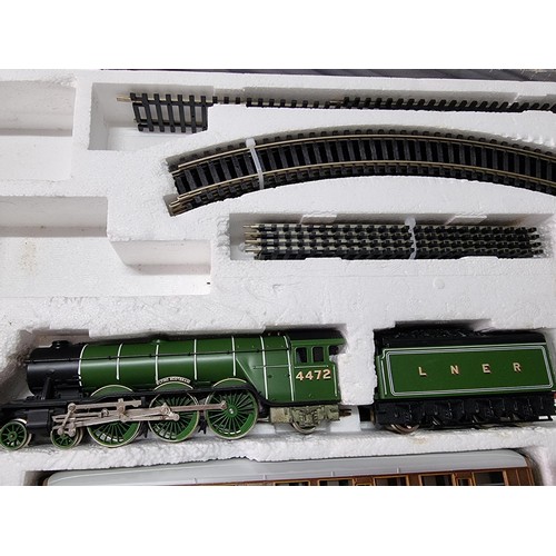 129 - A boxed Hornby R869 Flying Scotsman train set with starter oval, complete and in excellent clean con... 