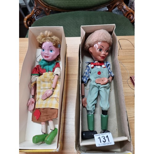 131 - 2x vintage boxed Pelham puppets along with one other vintage wooden puppet (missing arms).