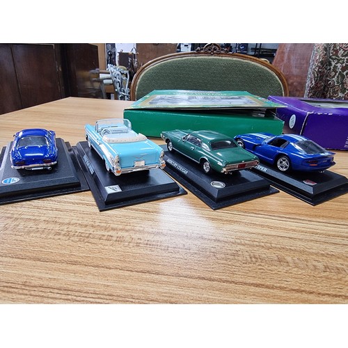 132 - A quantity of collectable die cast cars to include a Christmas collection 10 car boxed set by Cameo ... 