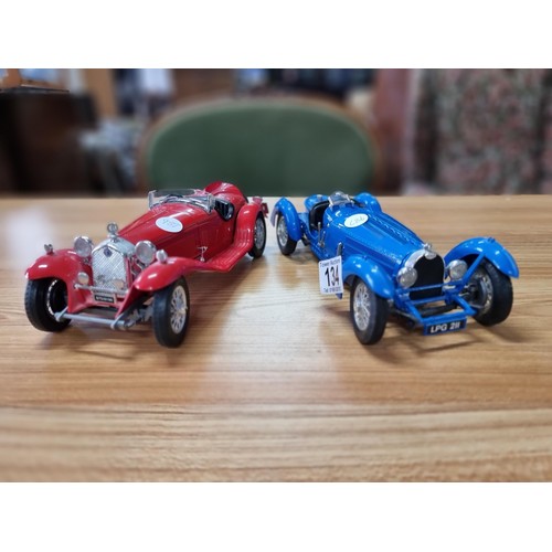 134 - 2 large diecast scale model cars by Burago, both are 1/18 scale, to include a Bugatti type 59 and a ... 