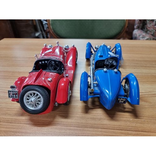 134 - 2 large diecast scale model cars by Burago, both are 1/18 scale, to include a Bugatti type 59 and a ... 