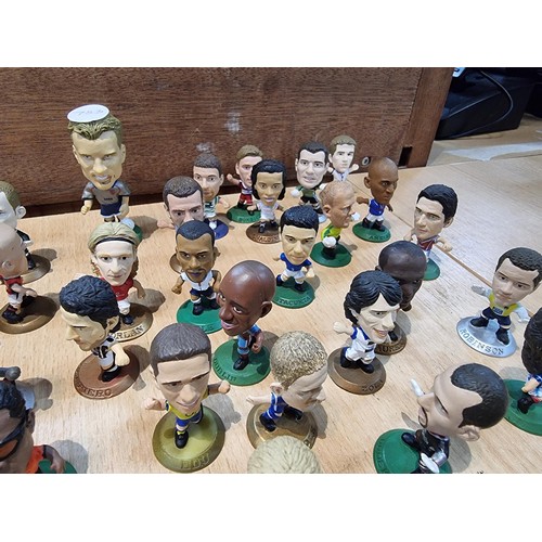 139 - A large collection of approx 55x miniature football figurines by Corinthian  dated between 1999-2004... 