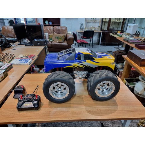 140 - A very large RC 4x4 monster truck complete with controller and charger featuring giant wheels. Heigh... 