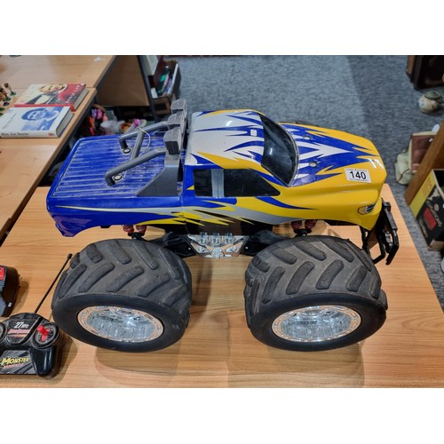 140 - A very large RC 4x4 monster truck complete with controller and charger featuring giant wheels. Heigh... 