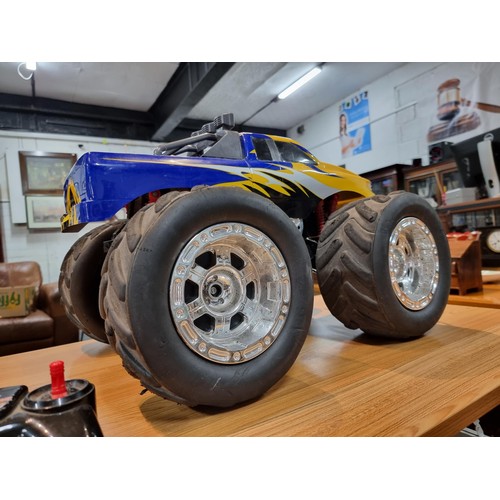 140 - A very large RC 4x4 monster truck complete with controller and charger featuring giant wheels. Heigh... 