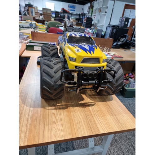 140 - A very large RC 4x4 monster truck complete with controller and charger featuring giant wheels. Heigh... 