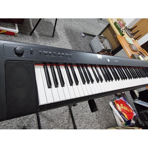 142 - A Yamaha Piaggero MP/31 76 springback key keyboard with fold up keyboard stand, in full working orde... 