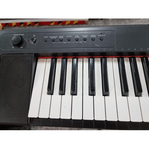 142 - A Yamaha Piaggero MP/31 76 springback key keyboard with fold up keyboard stand, in full working orde... 