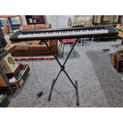 142 - A Yamaha Piaggero MP/31 76 springback key keyboard with fold up keyboard stand, in full working orde... 