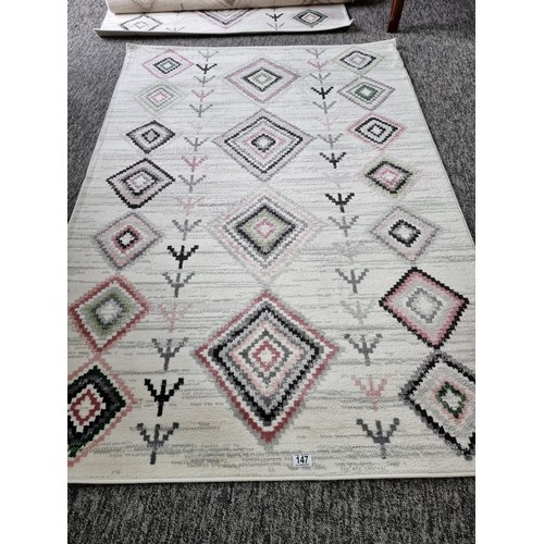 147 - 2x as new rugs by habitat with a geometric design both are 120 x 170cm, both are matching.