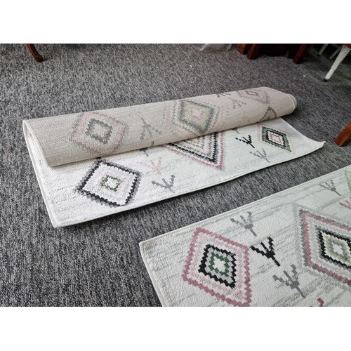 147 - 2x as new rugs by habitat with a geometric design both are 120 x 170cm, both are matching.