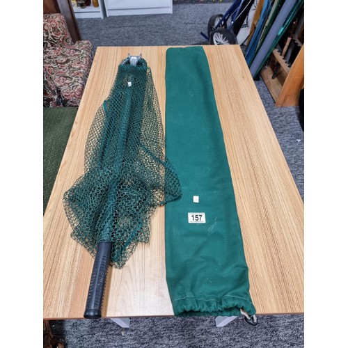 157 - A cased telescopic landing net in excellent clean condition.