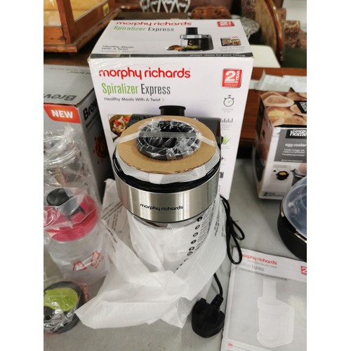 12 - A quantity of electrical kitchen items as new in boxes inc a Tefal soup maker, Morphy Richards Spira... 